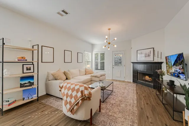 a bedroom with furniture and a fireplace