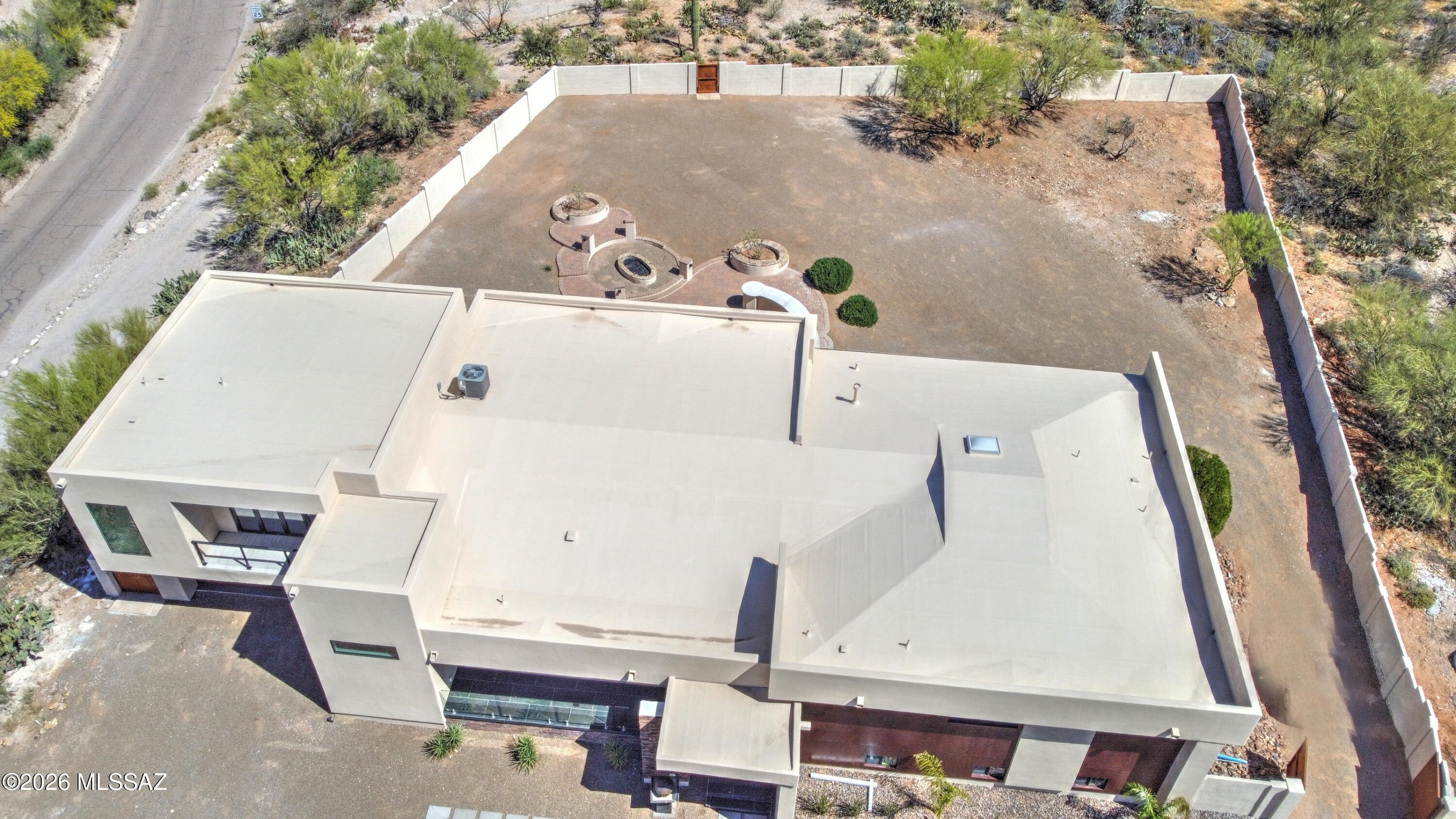 4939 East River Road Tucson, AZ 85718 - Photo 2 of 29 an aerial view of a house with a swimming pool