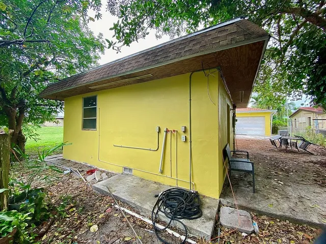 a backyard of a house with seating space