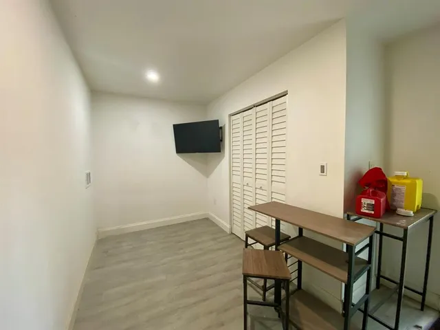 a view of a workspace with furniture