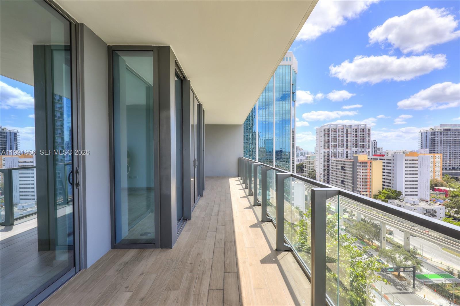 88 Southwest 7th Street, Unit 904 Miami, FL 33130 - Photo 22 of 26 a view of balcony with a hardwood