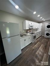 43 Hawkins Road, Unit 2 Marion, NC 28752 - Photo 2 of 10 a kitchen with stainless steel appliances a refrigerator sink and cabinets