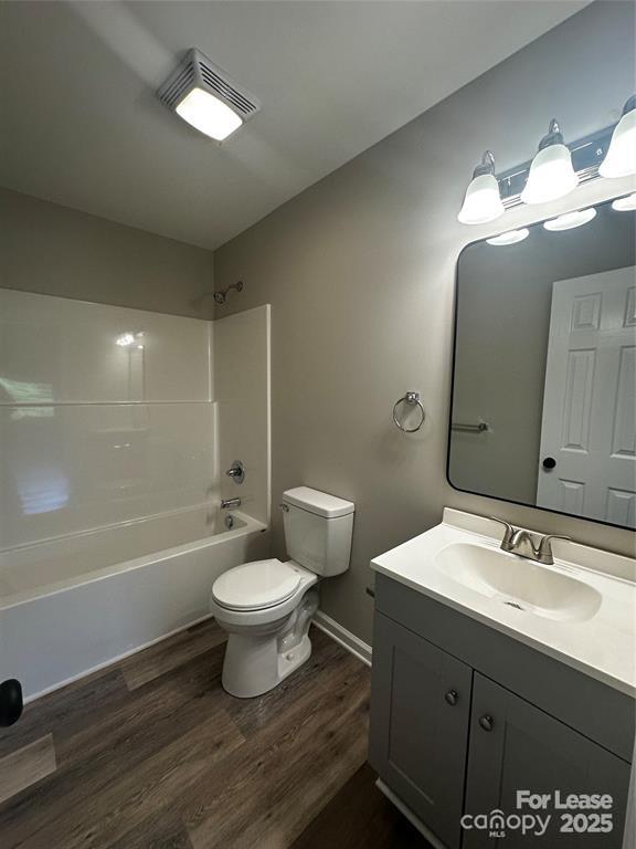 43 Hawkins Road, Unit 2 Marion, NC 28752 - Photo 5 of 10 a bathroom with a sink toilet a mirror and shower