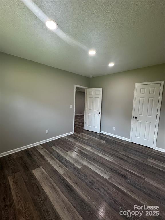 43 Hawkins Road, Unit 2 Marion, NC 28752 - Photo 7 of 10 an empty room with wooden floor and natural light