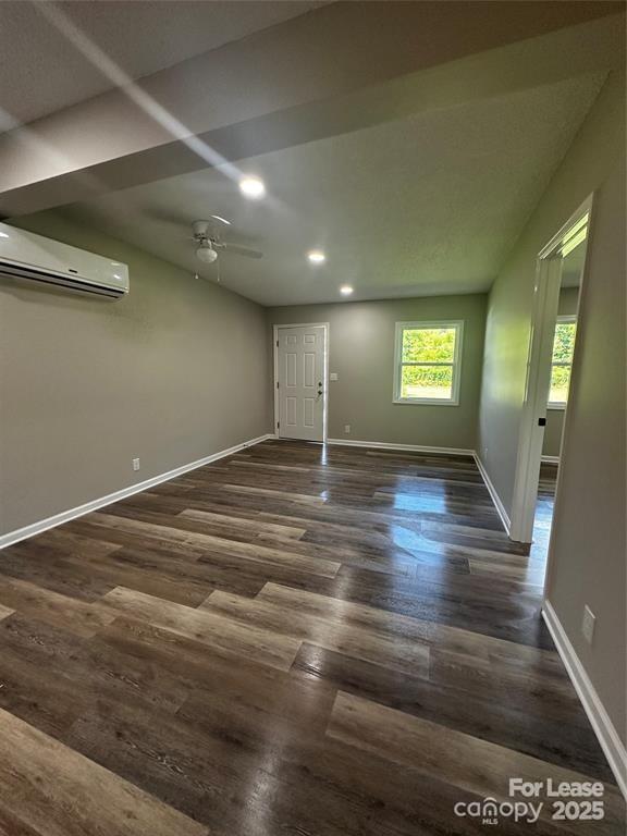 43 Hawkins Road, Unit 2 Marion, NC 28752 - Photo 8 of 10 a view of an empty room with window and wooden floor