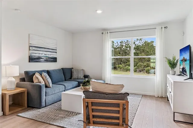 a living room with furniture and a window