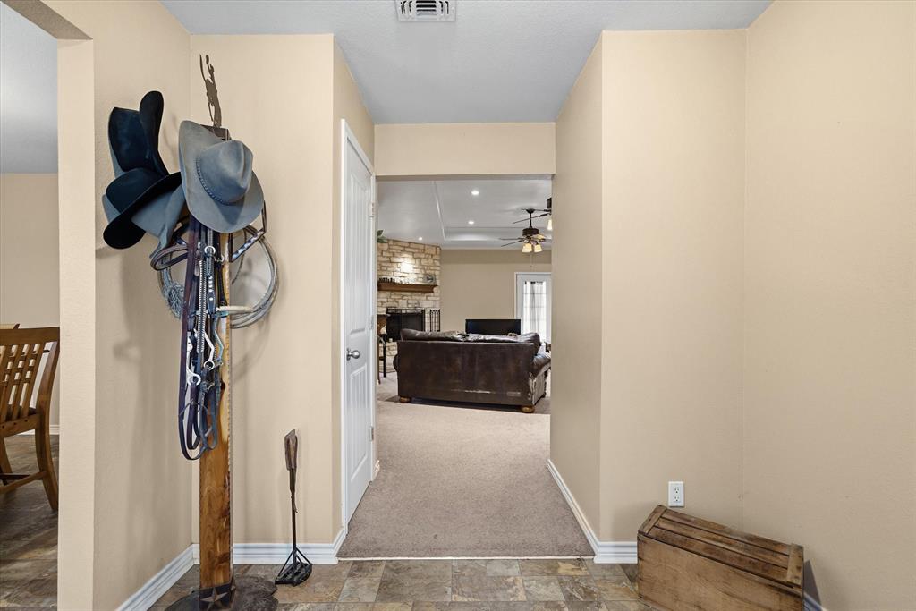 9111 County Road 313 Terrell, TX 75161 - Photo 12 of 40 a view of walk in closet with clothes and shoes
