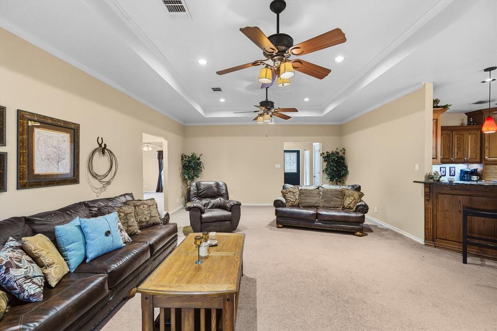 9111 County Road 313 Terrell, TX 75161 - Photo 17 of 40 a living room with furniture and a chandelier