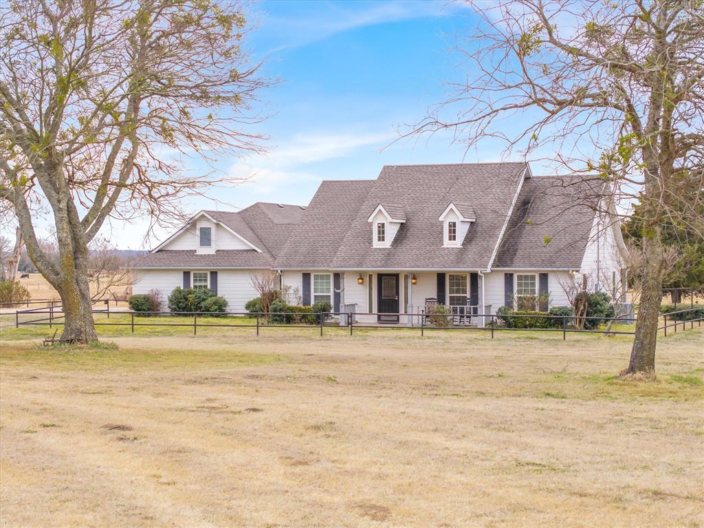 9111 County Road 313 Terrell, TX 75161 - Photo 2 of 40 a front view of residential houses with yard and swimming pool