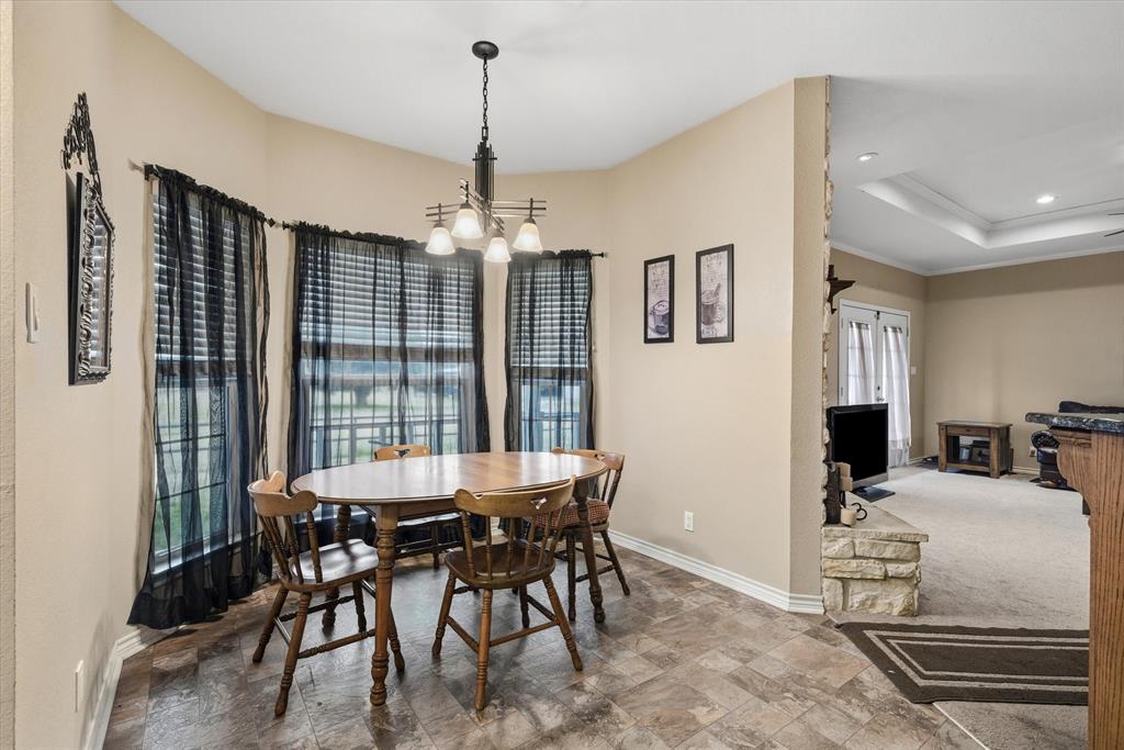 9111 County Road 313 Terrell, TX 75161 - Photo 22 of 40 a view of a dining room with furniture window and outside view