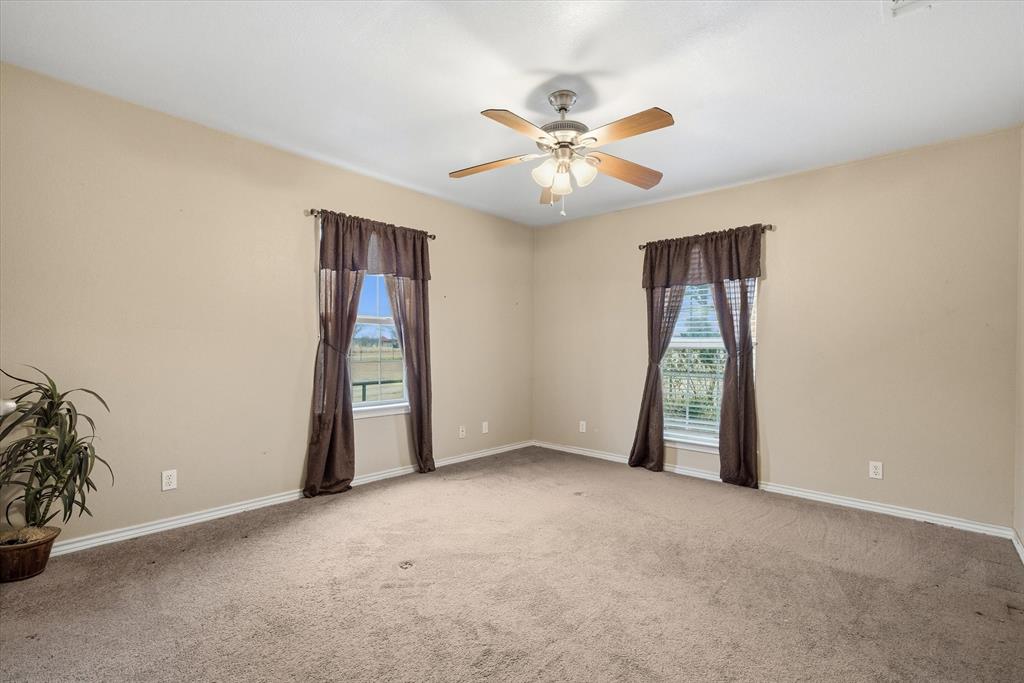 9111 County Road 313 Terrell, TX 75161 - Photo 28 of 40 an empty room with windows and fan