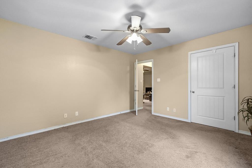 9111 County Road 313 Terrell, TX 75161 - Photo 29 of 40 a view of an empty room and chandelier fan