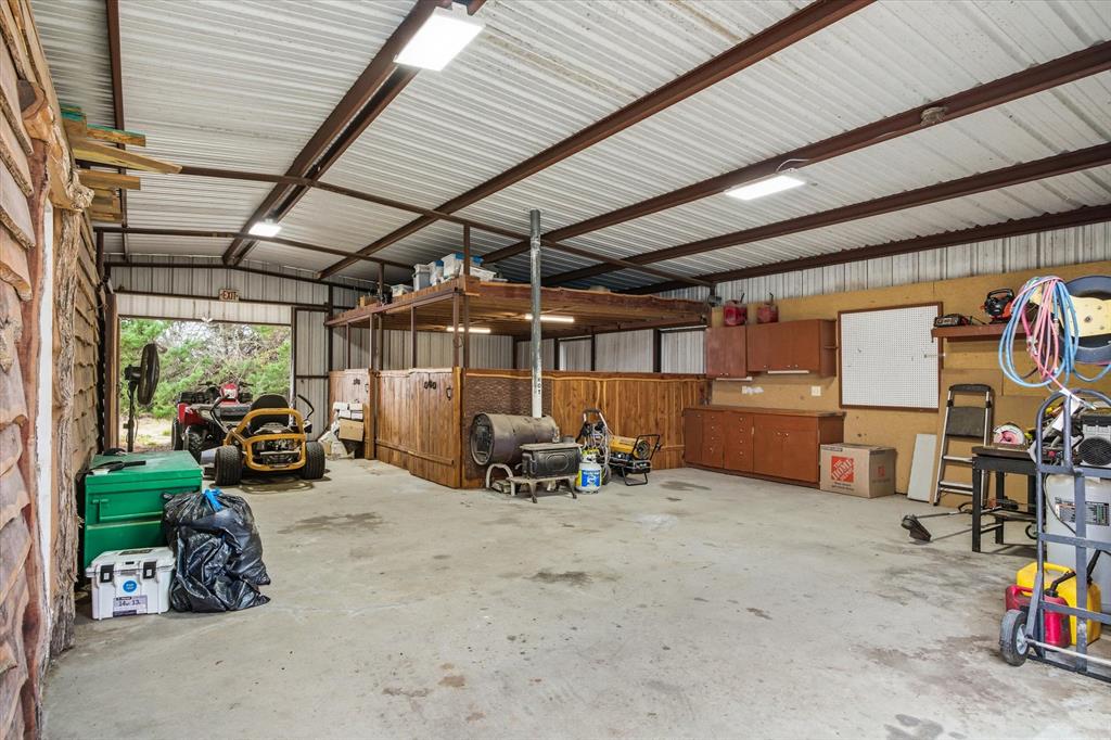 9111 County Road 313 Terrell, TX 75161 - Photo 37 of 40 a view of a garage with a table and chairs