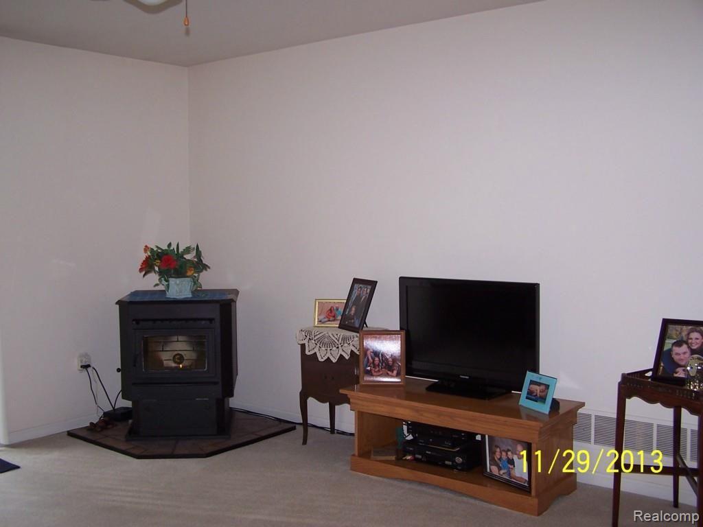 4532 Milner Road Stockbridge, MI 49285 - Photo 4 of 15 LIVING ROOM, CORN BURNER