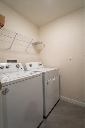 a kitchen with stainless steel appliances granite countertop a sink refrigerator and microwave