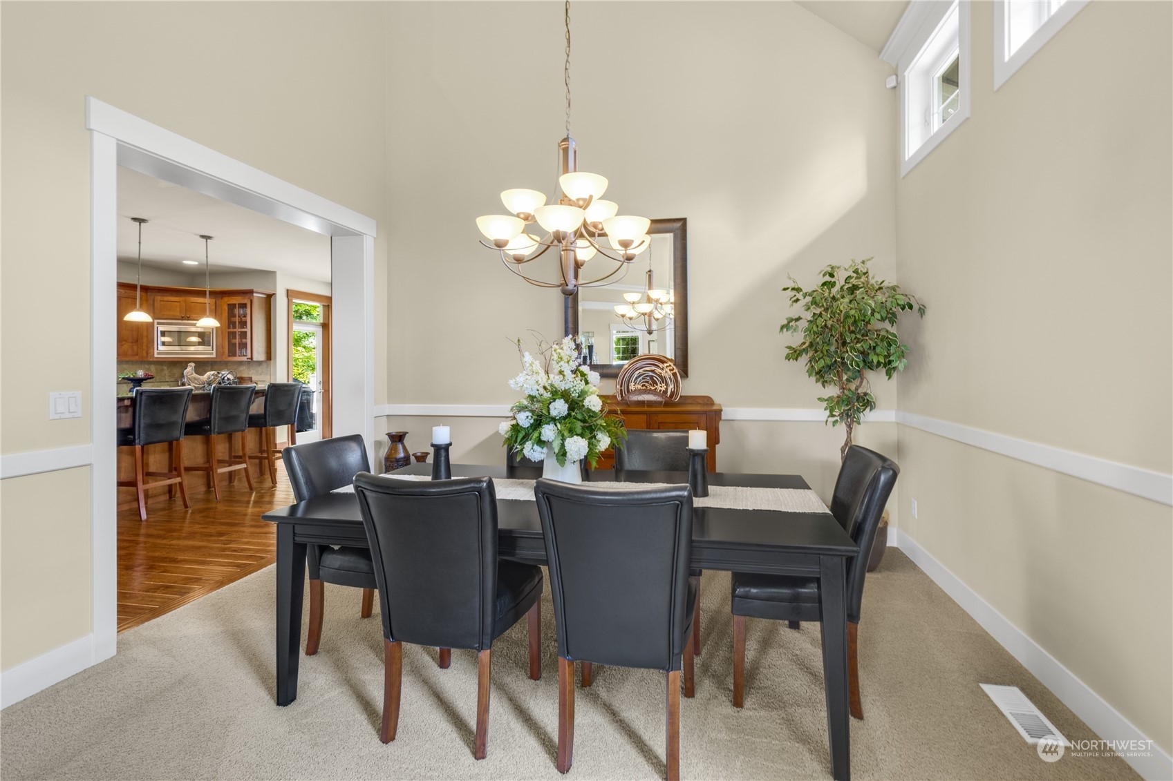 4205 221st Place Southeast Bothell, WA 98021 - Photo 12 of 32 a dining room with furniture potted plants and wooden floor