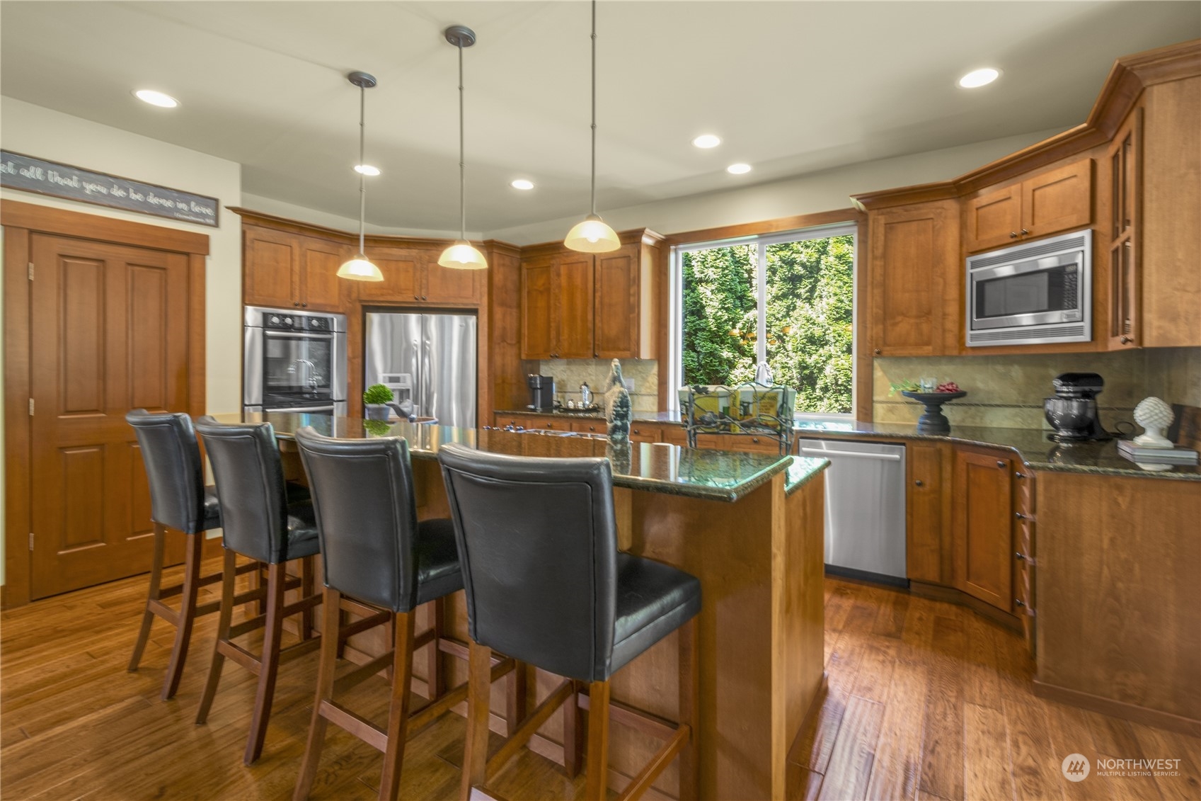 4205 221st Place Southeast Bothell, WA 98021 - Photo 14 of 32 a large kitchen with a table and chairs