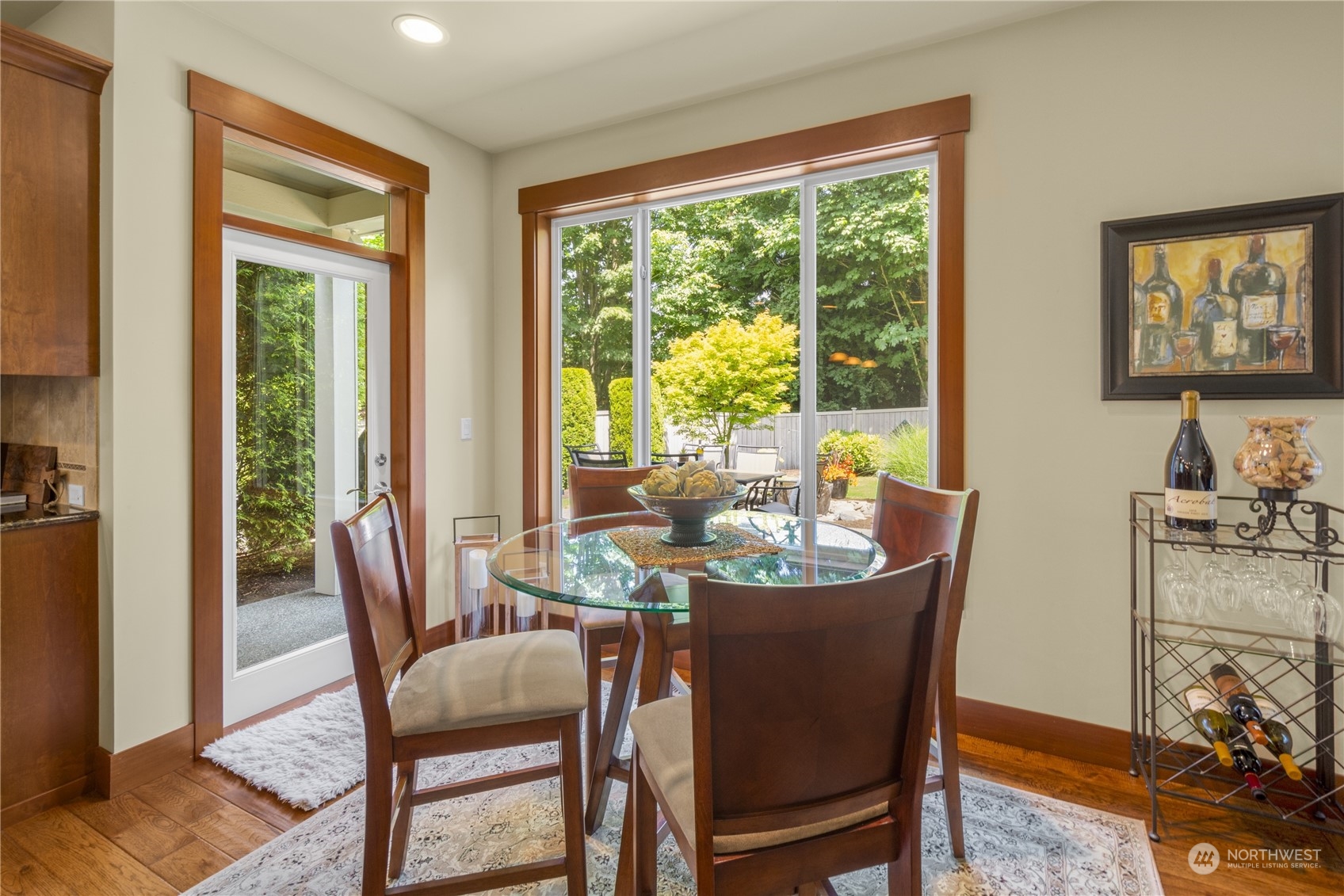 4205 221st Place Southeast Bothell, WA 98021 - Photo 16 of 32 a dining room with furniture a large window and a rug