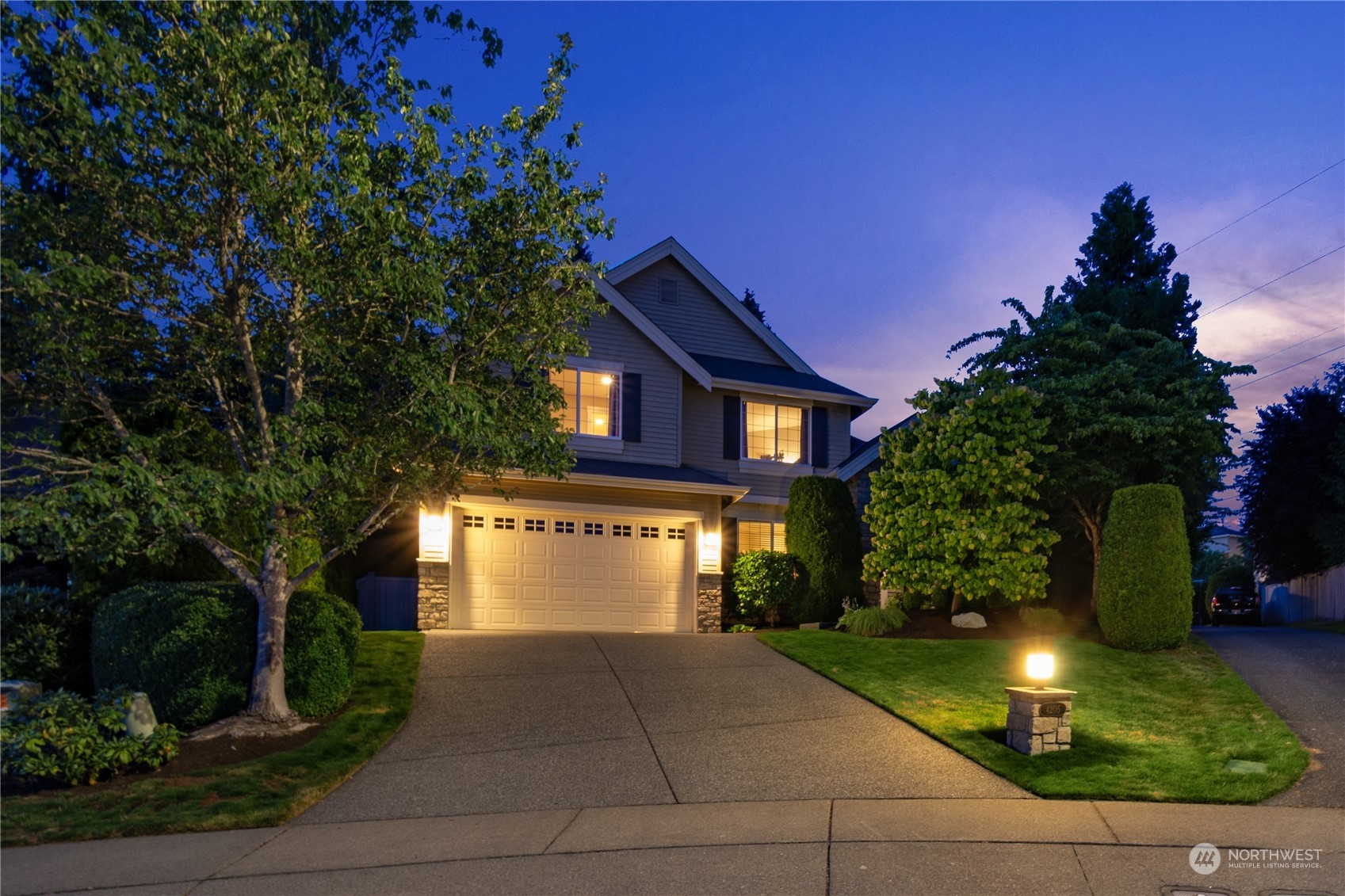 4205 221st Place Southeast Bothell, WA 98021 - Photo 2 of 32 a front view of a house with yard