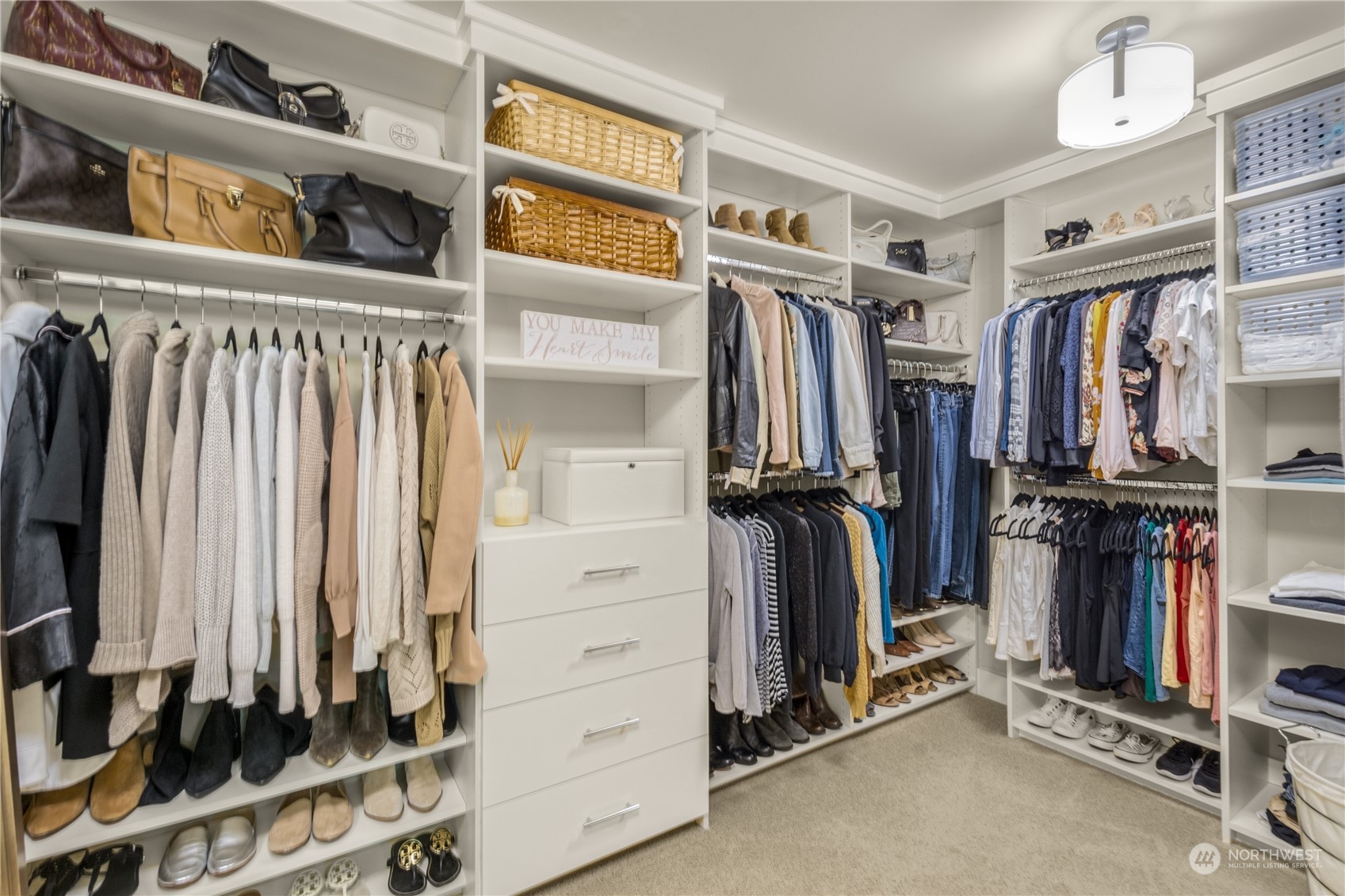 4205 221st Place Southeast Bothell, WA 98021 - Photo 23 of 32 a view of walk in closet with clothes and shoes