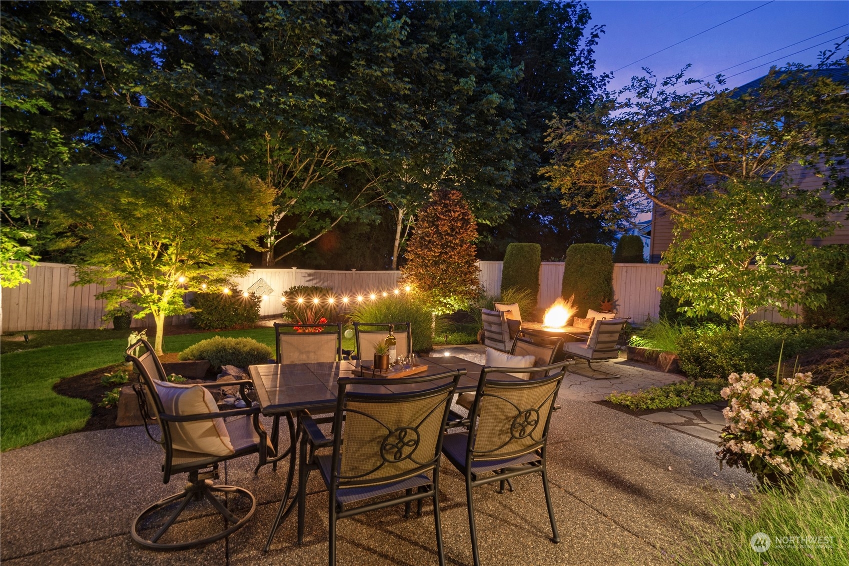 4205 221st Place Southeast Bothell, WA 98021 - Photo 30 of 32 a view of a patio with table and chairs and potted plants