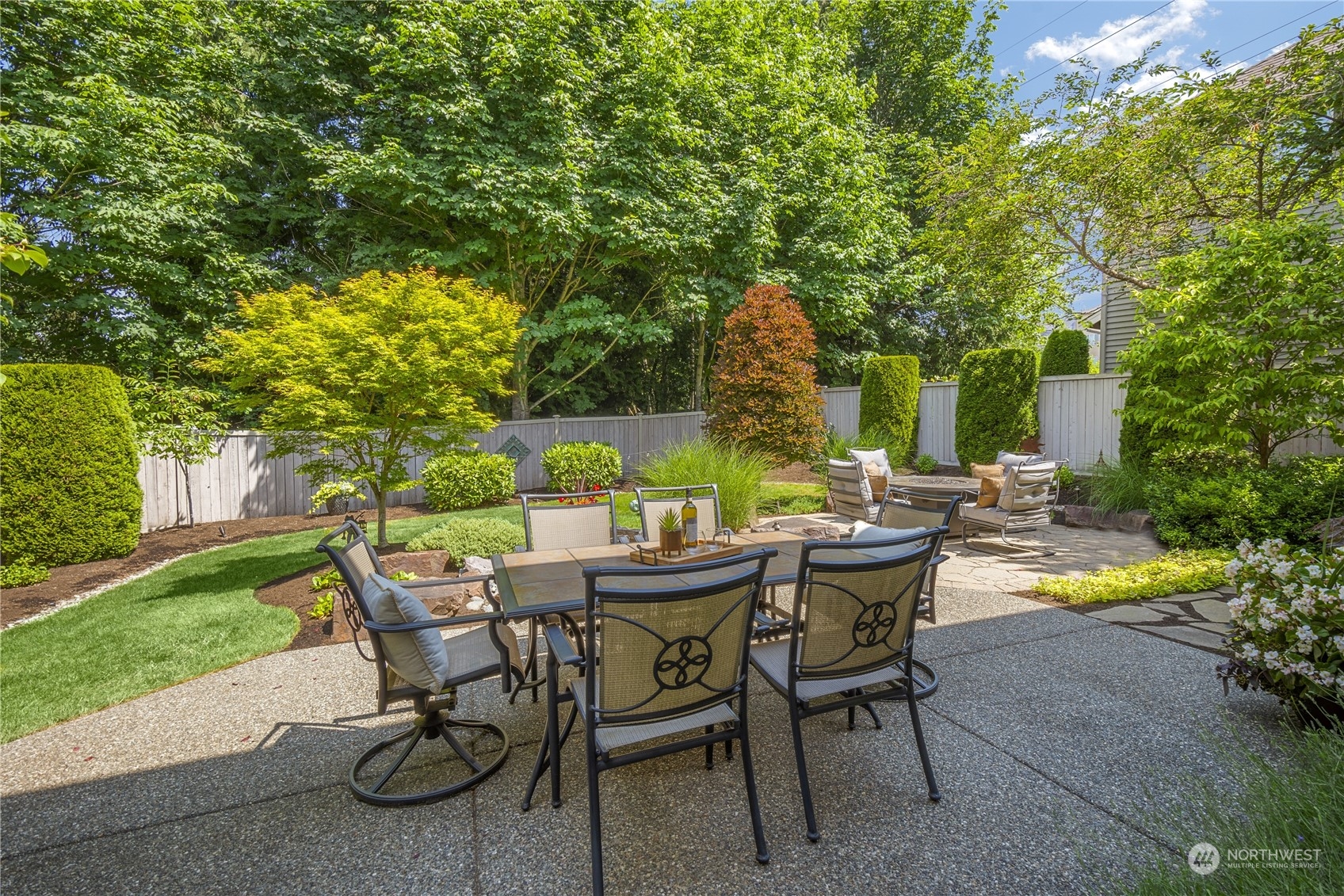 4205 221st Place Southeast Bothell, WA 98021 - Photo 31 of 32 a view of a dining table and chairs in the patio