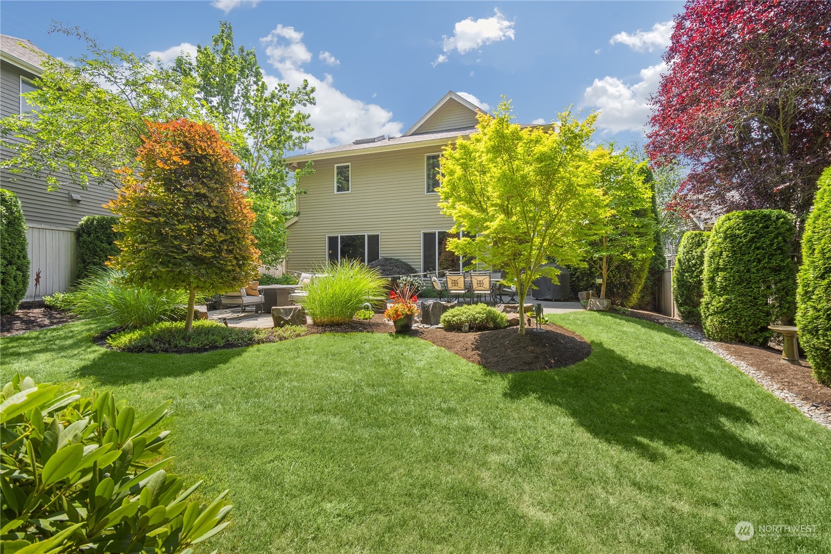 4205 221st Place Southeast Bothell, WA 98021 - Photo 32 of 32 a view of a backyard with plants and a patio