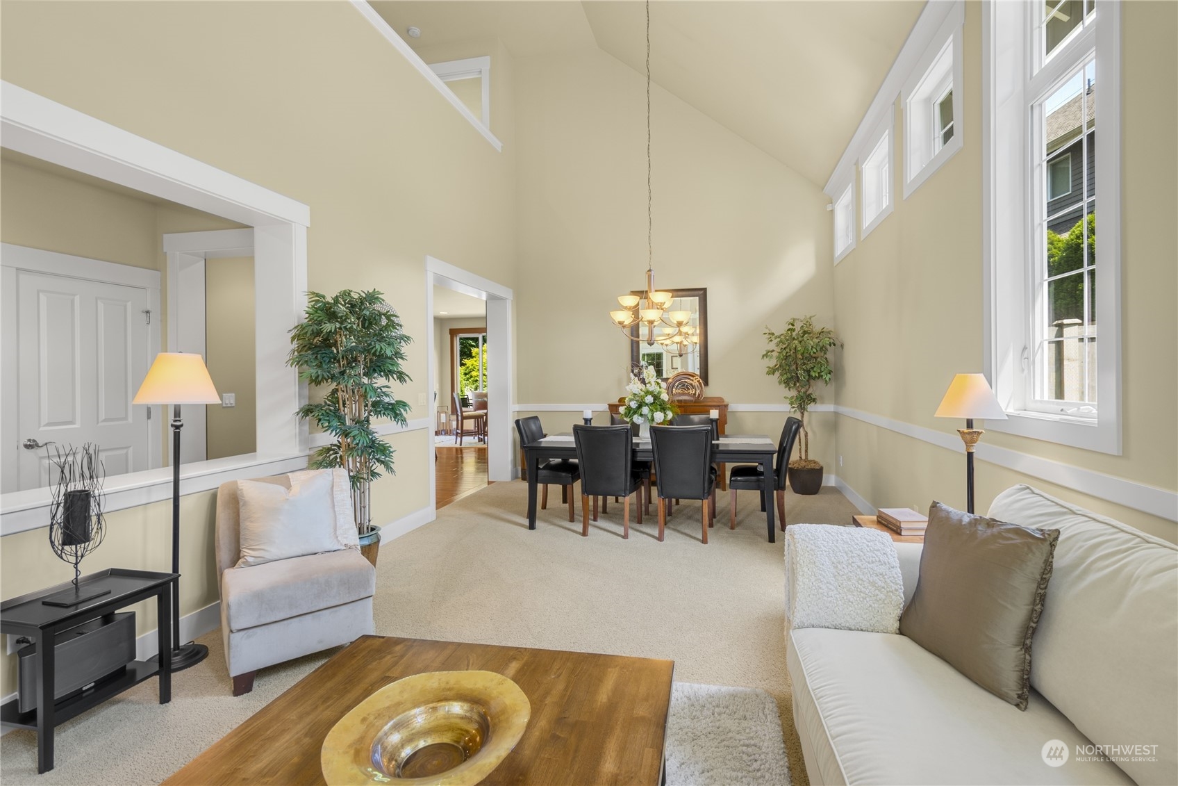 4205 221st Place Southeast Bothell, WA 98021 - Photo 8 of 32 a living room with furniture and a chandelier