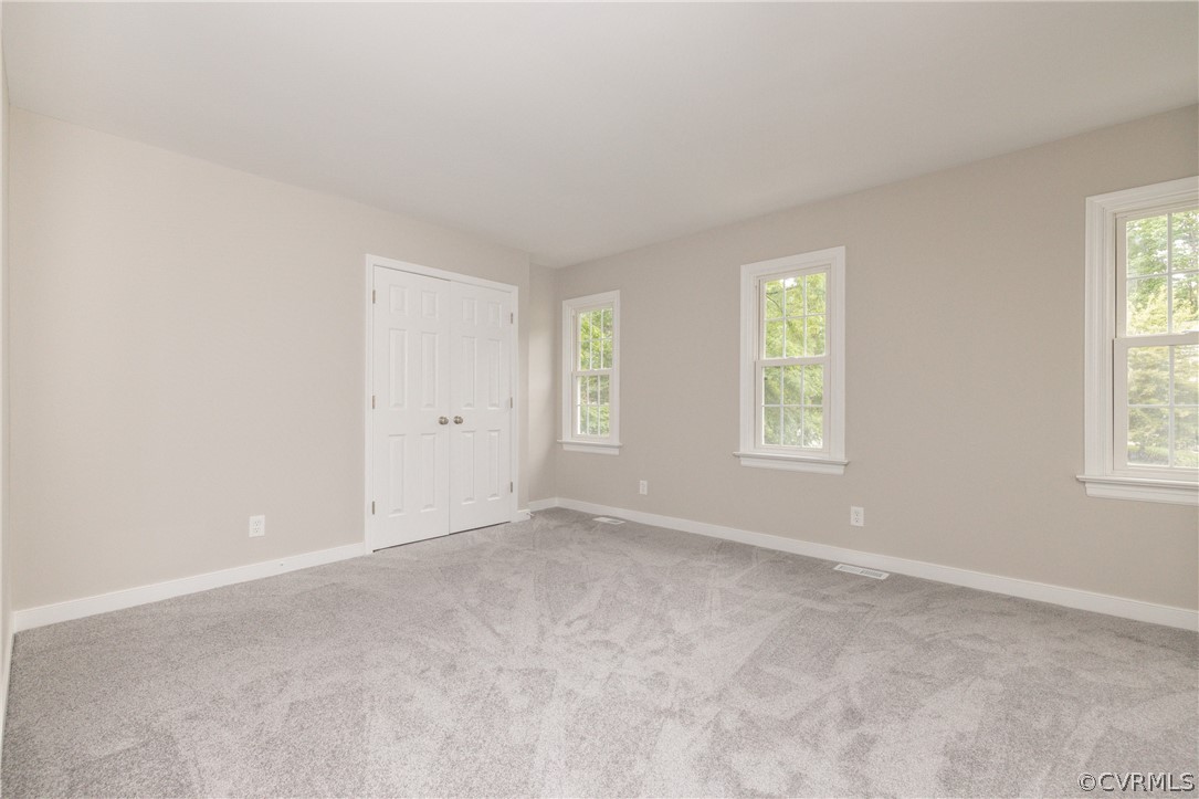 5403 Standing Oak Road Midlothian, VA 23112 - Photo 14 of 22 an empty room with windows