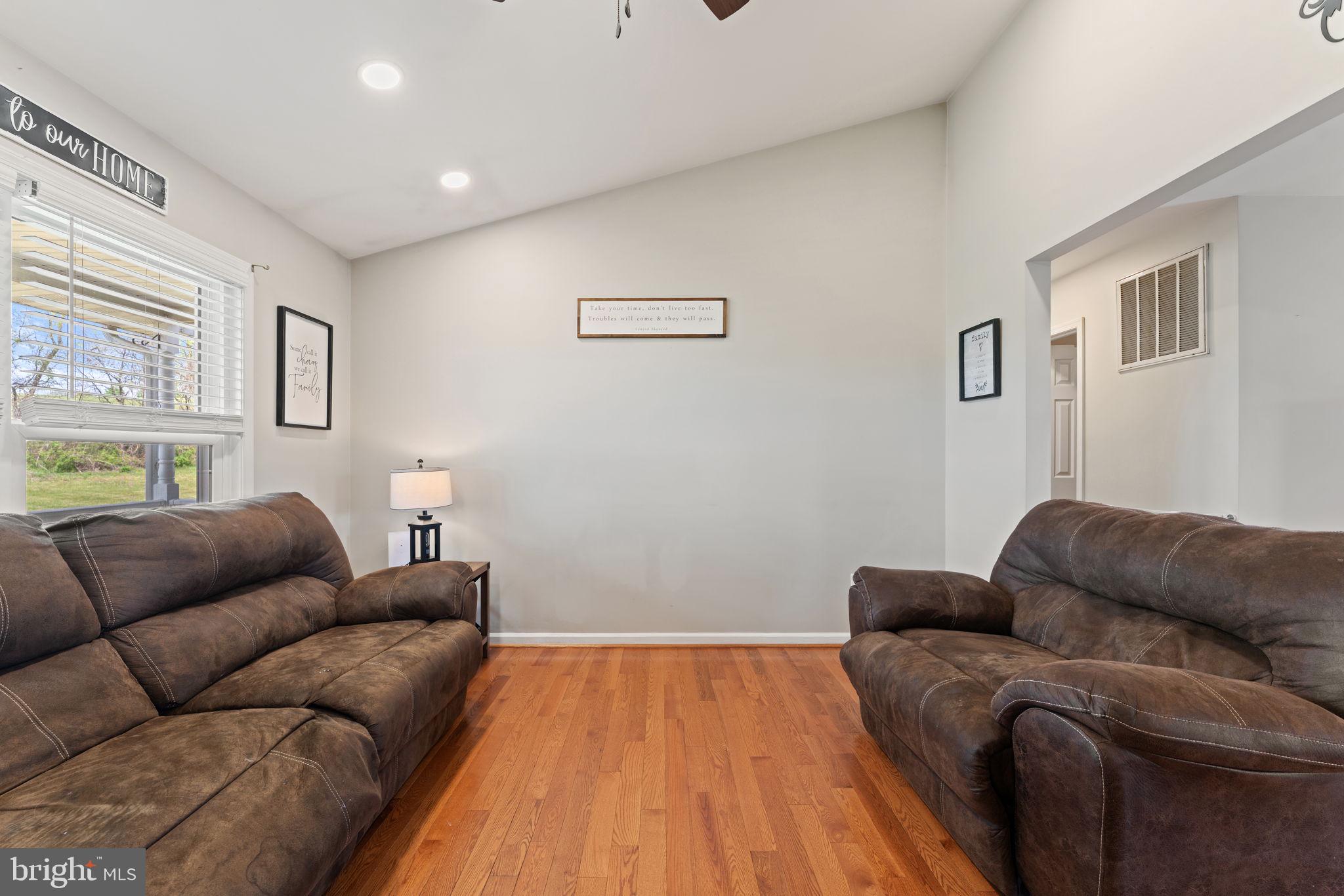 1388 Novum Church Road Reva, VA 22735 - Photo 15 of 65 a living room with furniture and a wooden floor