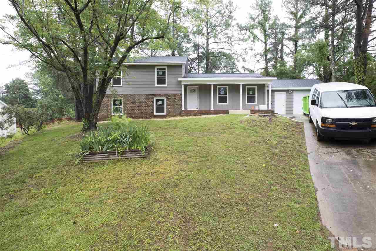3108 Orton Place Raleigh, NC 27607 - Photo 1 of 8 a front view of a house with a garden