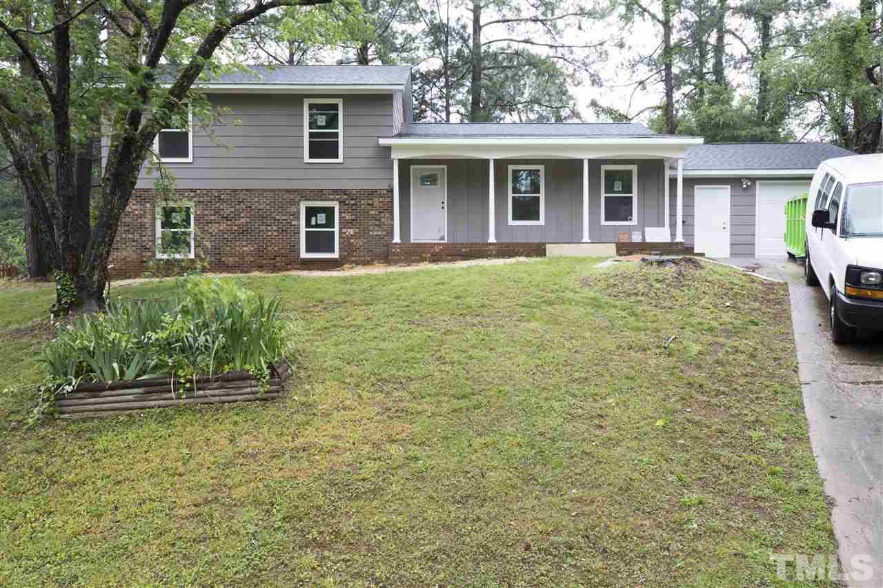 3108 Orton Place Raleigh, NC 27607 - Photo 2 of 8 a front view of a house with a yard