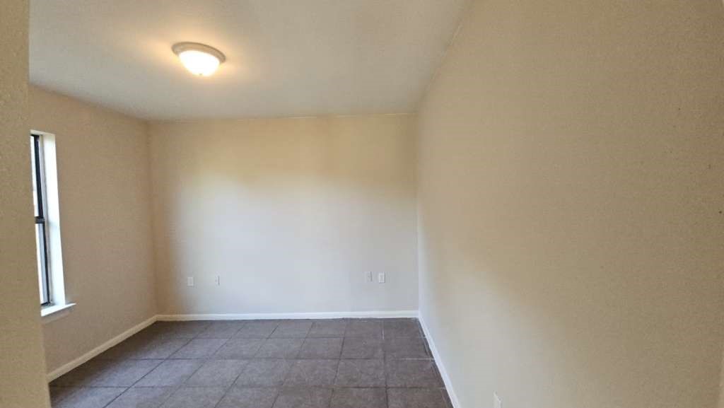 3418 Memel Street Houston, TX 77026 - Photo 12 of 19 a view of an empty room with a window