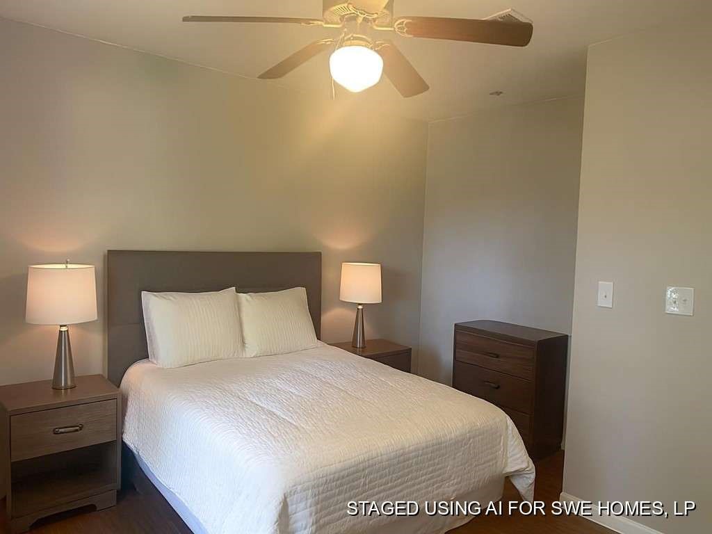 3418 Memel Street Houston, TX 77026 - Photo 14 of 19 a bedroom with a bed and a lamp