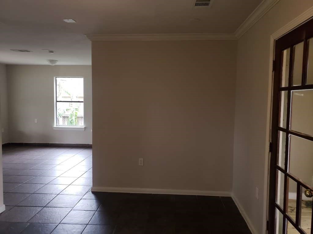 3418 Memel Street Houston, TX 77026 - Photo 5 of 19 an empty room with windows