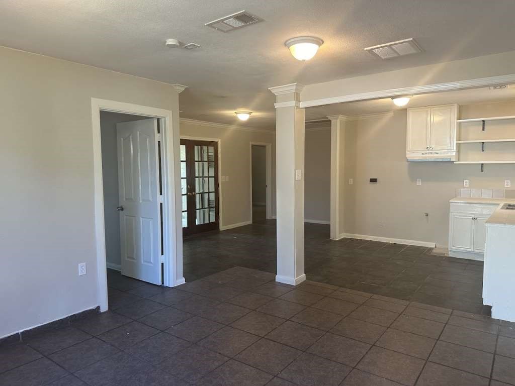 3418 Memel Street Houston, TX 77026 - Photo 6 of 19 a view of a hallway with closet and a bathroom
