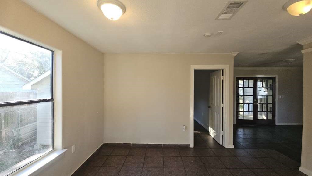 3418 Memel Street Houston, TX 77026 - Photo 7 of 19 a view of an empty room and window