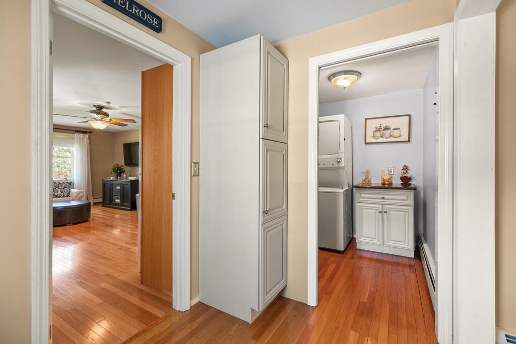 81 Baxter Street Melrose, MA 02176 - Photo 14 of 33 a kitchen with a refrigerator and wooden floor