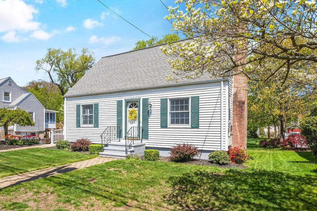 81 Baxter Street Melrose, MA 02176 - Photo 2 of 33 a front view of a house with a yard and outdoor seating