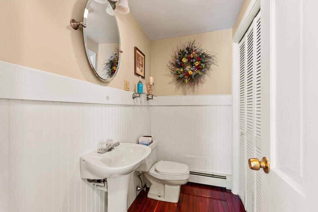 81 Baxter Street Melrose, MA 02176 - Photo 21 of 33 a bathroom with a sink mirror and toilet