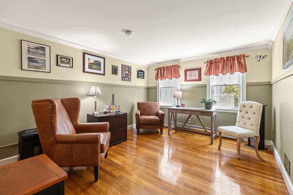 81 Baxter Street Melrose, MA 02176 - Photo 22 of 33 a living room with furniture and a wooden floor