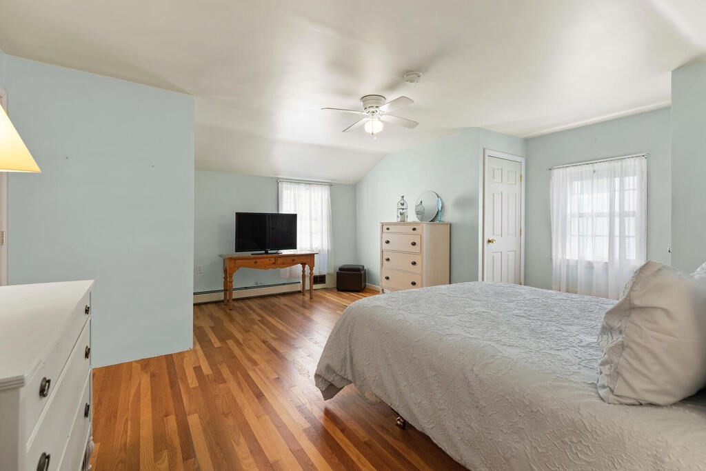 81 Baxter Street Melrose, MA 02176 - Photo 24 of 33 a bedroom with a bed and a flat screen tv