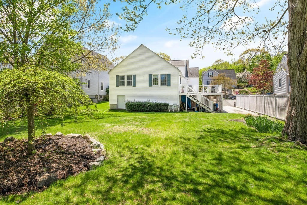 81 Baxter Street Melrose, MA 02176 - Photo 31 of 33 a view of a house with backyard and a tree