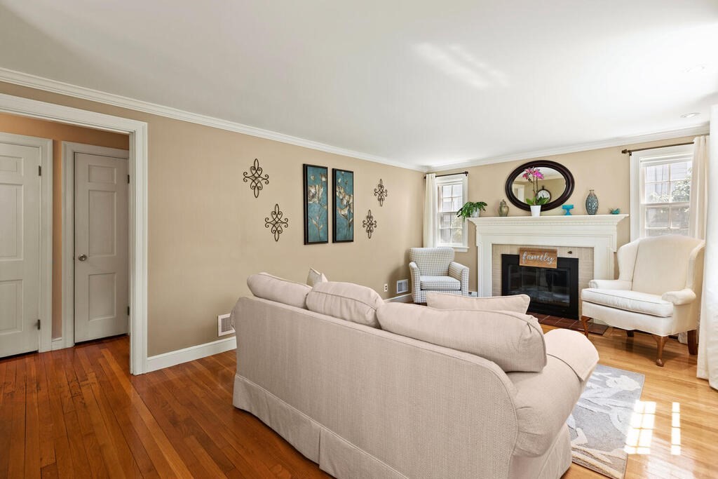 81 Baxter Street Melrose, MA 02176 - Photo 4 of 33 a living room with furniture and a fireplace