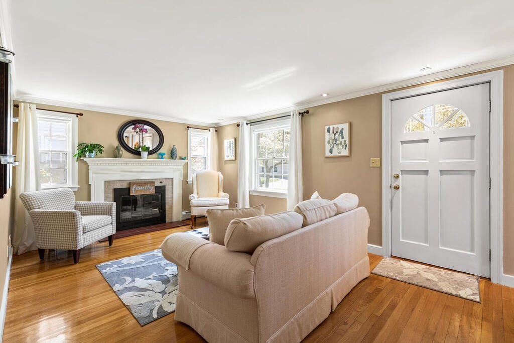 81 Baxter Street Melrose, MA 02176 - Photo 5 of 33 a living room with furniture and a fireplace