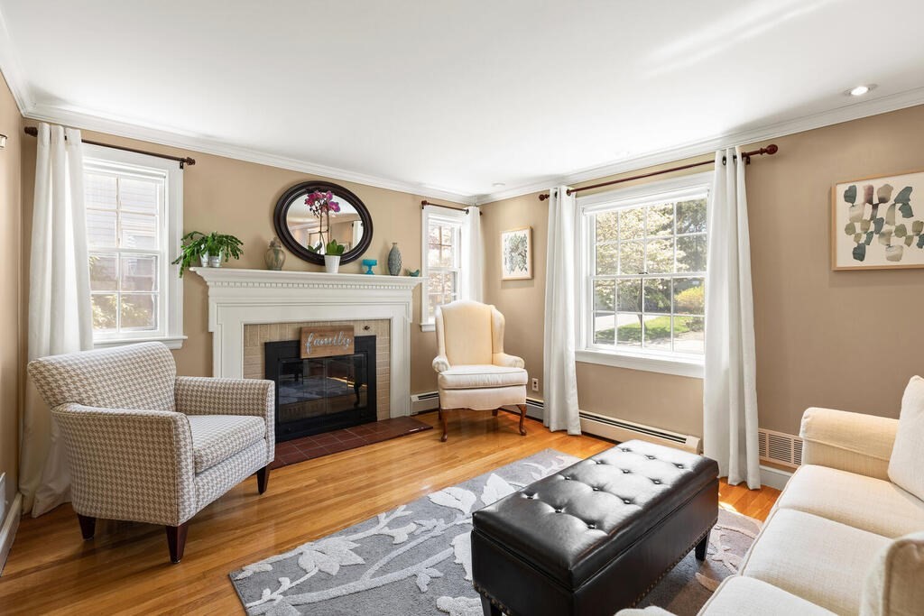 81 Baxter Street Melrose, MA 02176 - Photo 6 of 33 a living room with furniture and a fireplace