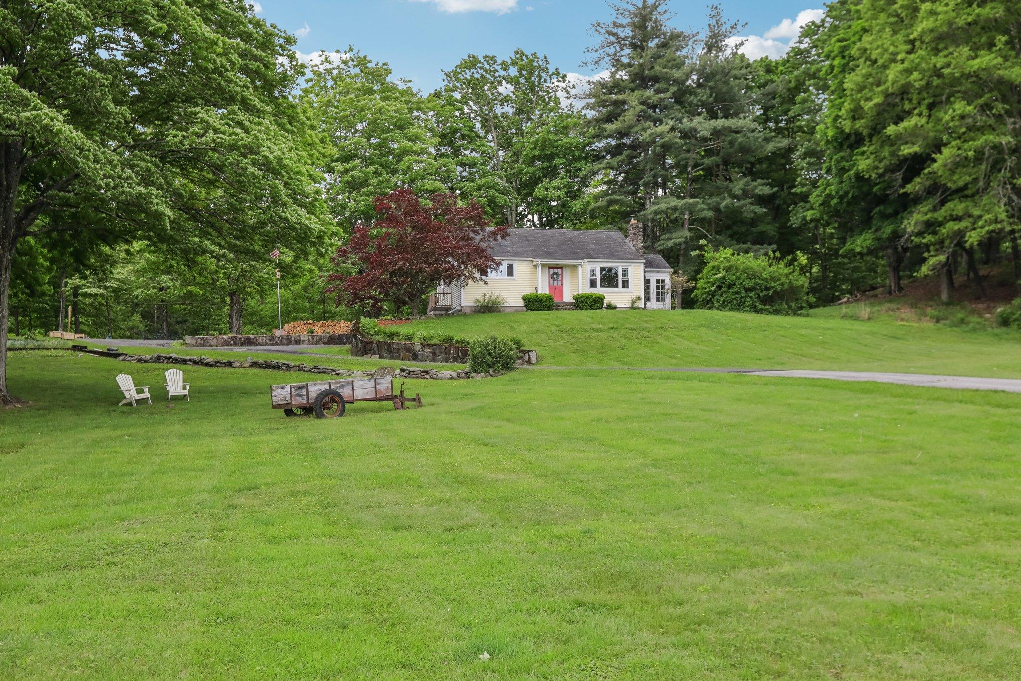 a front view of a house with garden