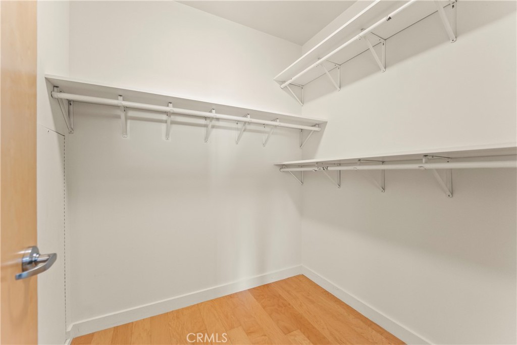 1100 South Hope Street, Unit 1704 Los Angeles, CA 90015 - Photo 18 of 26 a view of a room with racks on the wall