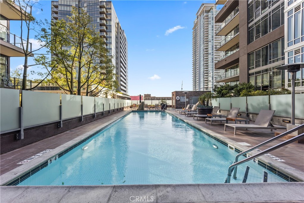 1100 South Hope Street, Unit 1704 Los Angeles, CA 90015 - Photo 20 of 26 a view of a swimming pool with outdoor seating