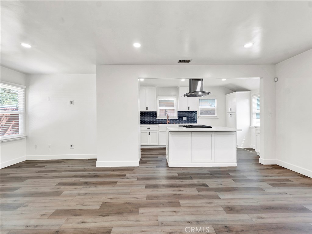 7517 Louise Avenue Lake Balboa, CA 91406 - Photo 4 of 18 a view of kitchen with kitchen island white cabinets and stainless steel appliances
